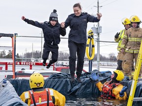 Brantford Police Sgt.  Amber Jackson and her son Jackson Baxter, 9, take the Polar Plunge on Saturday.