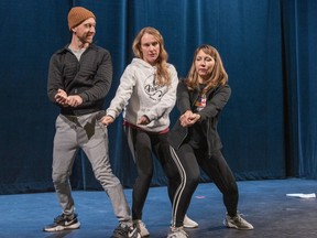 Actors Adam Liefl and Carmen Davis take instruction from choreographer Kiri-Lyn Muir (right) during a rehearsal of CLUE The Musical at Lighthouse Festival Theatre in Port Dover.