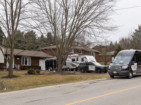 Ontario Provincial Police remain at a Mechanic Street West home in Waterford, Ontario on Thursday as a homicide investigation continues.