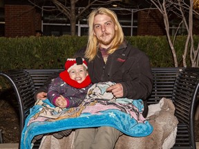 Lawrence Xurieb and his three-year-old daughter Ivy brought blankets to keep warm as they wait for the start of fireworks to cap off Family Day activities at Harmony Square in downtown Brantford.