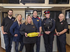 A partnership between Brantford Police, Brant-Brantford Crime Stoppers, Midas, and APC Auto Parts Centers has resulted in a program to determine the theft of catalytic converters.  Pictured are (left to right) Kevin Mahoney and Tracy Cromwell of APC, Midas Brantford manager Susan McDougall and technician Jim Coutts, Const.  K. Carney of Brantford Police, and Const.  E. Bragg, co-ordinator of Brant-Brantford Crime Stoppers.