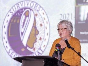 Dawn Hill, a survivor of the Mohawk Institute residential school and member of the Survivor's Secretariat board of directors, speaks during an annual general meeting on Tuesday.