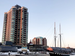 The Tall Ships Landing condominium tower, at left, the Aquatarium, centre, and the tall ship Fair Jeanne bask in a winter sunset on Tuesday, Feb. 14, 2023 in Brockville, Ont. (RONALD ZAJAC/The Recorder and Times)