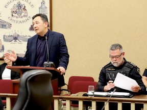 Brockville police services board chairman King Yee, Jr. discusses the police budget at Tuesday's council meeting, while Police Chief Mark Noonan listens. (RONALD ZAJAC/The Recorder and Times)