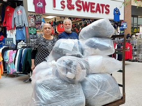 Inder Gahnuia, left, and her husband and Jarnail  Gahunia, who own T's & Sweats in the Downtown Chatham Centre, are dipping into their store's inventory to donate approximately $7,000 worth new clothing to help earthquake victims in Turkey . Ellwood Shreve