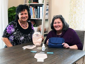 Chatham Ostomy Support Group founders Lori Zozzolotto (left) and Katherine Verrall are shown with various ostomy supplies on Feb. 8. The group meets the second Wednesday of the month at Christ Church Chatham. (Tom Morrison/Chatham This Week)