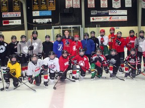 2023 IIHF Women's Under-18 Ice Hockey World Championship gold medalist Jocelyn Amos of Ailsa Craig, center back in Team Canada jersey, visited Exeter's professional ice skating coach Kathy McLlwain (back left) and some of her skaters on January 31 at the South Huron Rec Center Exeter Scott Nixon