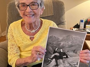 Terri Lalonde, holding a print of a Standard-Freeholder front-page photo from 1965, when she had the role of Maria von Trapp in the first Cornwall production of The Sound of Music. Photo on Wednesday, February 15, 2023, in Cornwall, Ont. Todd Hambleton/Cornwall Standard-Freeholder/Postmedia Network