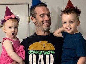 Sam Cronin, pictured here with his two young children, one-year-old Olive and three-year-old Tanner, is in a London hospital Saturday with severe injuries after being struck by a car in Owen Sound Thursday evening. His friends, family and the wider community have raised over $5,000 to help in his road to recovery. Photo submitted.