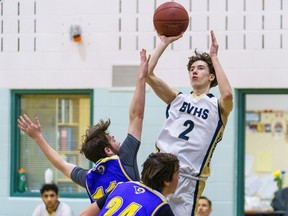 Bow Valley Bobcats Ethan Horb leaps for a shot from the three point line against the Bert Church Chargers at Bow Valley High School in Cochrane on Monday, Feb. 13, 2023.