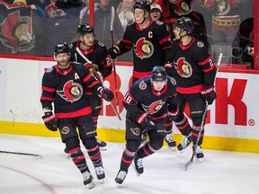 Feb 19, 2023; Ottawa Senators' left wing Tim Stutzle (18) celebrates with his team after scoring in the third period against the St. Louis Blues at the Canadian Tire Centre. Attendance is up this year, even though the arena isn't centrally located.