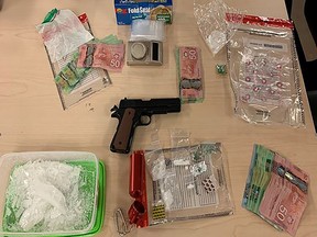 Illicit drugs, cash and other illegaI items confiscated by Kingston Police on Friday, Feb. 4, 2023.