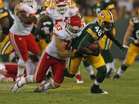 Brandon Bostick (48) of the Green Bay Packers is tackled by Cory Greenwood (93) of the Kansas City Chiefs during a pre-season National Football League game at Lambeau Field in Green Bay, Wis., on Aug. 30, 2012.