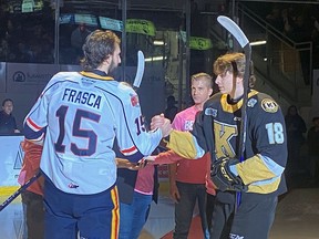 Frasca brothers shake hands