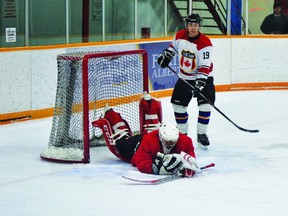 Piikani Nation goalie Tim North Peigan covers the puck during the Pincher Creek Old Timers Hockey Club's 42nd annual hockey tournament, which took place Jan. 27-29. Piikani won this game 3-2 against the Pincher Creek's Road Apples.