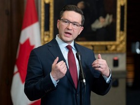 Conservative Leader Pierre Poilievre responds to a reporter's question in the Foyer of the House of Commons, in Ottawa, Feb. 21, 2023.