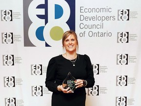 Meredith Forget, Perth County's manager of economic development and tourism, holds the Joseph A. Montgomery Economic Development Achievement Award.  Forget was given the prestigious economic development award at the Economic Developers Council of Ontario's awards dinner in Toronto on Thursday.  (Contributed photo)