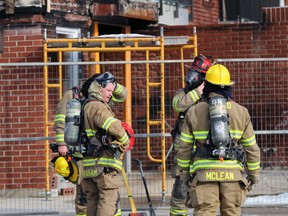 Petrolia and North Enniskillen firefighters work at an apartment building on Greenfield Street in Petrolia after a fire broke out there Sunday afternoon.  Terry Bridge/Sarnia Observer/Postmedia Network
