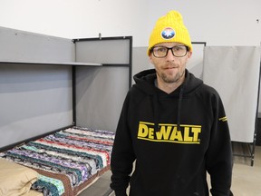 Ryan Hambleton stands in expanded space at the River City Vineyard shelter in Sarnia.  The shelter held an open house Saturday to show the public progress on the expansion expected to open soon.