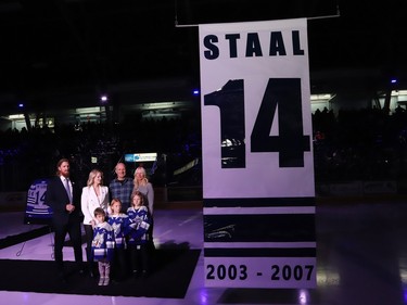 Former Sudbury Wolves great Marc Staal, along with his wife, Lindsay, and their kids, Jack, Emily and Anna, and his parents, Henry and Linda, look up as StaalÕs number is raised to the rafters during a Wolves pre-game ceremony at the Sudbury Community Arena in Sudbury, Ont. on Friday February 3, 2023. John Lappa/Sudbury Star/Postmedia Network