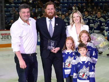 Sudbury Wolves owner Dario Zulich, left, presented a plaque to former Sudbury Wolves great Marc Staal as his family, including his wife, Lindsay, and their kids, Jack, Emily and Anna, look on at a Wolves pre-game ceremony at the Sudbury Community Arena in Sudbury, Ont. on Friday February 3, 2023. John Lappa/Sudbury Star/Postmedia Network
