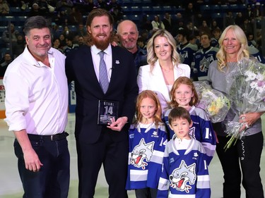 Sudbury Wolves owner Dario Zulich, left, presented a plaque to former Sudbury Wolves great Marc Staal as his family, including his wife, Lindsay, and their kids, Jack, Emily and Anna, and his parents, Henry and Linda, look on at a Wolves pre-game ceremony at the Sudbury Community Arena in Sudbury, Ont. on Friday February 3, 2023. John Lappa/Sudbury Star/Postmedia Network