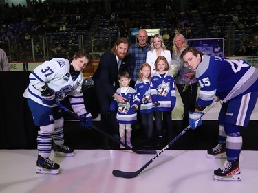 Former Sudbury Wolves great Marc Staal, along with his wife, Lindsay, and their kids, Jack, Emily and Anna, and his parents, Henry and Linda, take part in a ceremonial puck drop during a Wolves pre-game ceremony at the Sudbury Community Arena in Sudbury, Ont. on Friday February 3, 2023. John Lappa/Sudbury Star/Postmedia Network