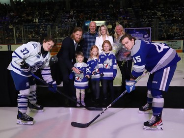 Former Sudbury Wolves great Marc Staal, along with his wife, Lindsay, and their kids, Jack, Emily and Anna, and his parents, Henry and Linda, take part in a ceremonial puck drop during a Wolves pre-game ceremony at the Sudbury Community Arena in Sudbury, Ont. on Friday February 3, 2023. John Lappa/Sudbury Star/Postmedia Network