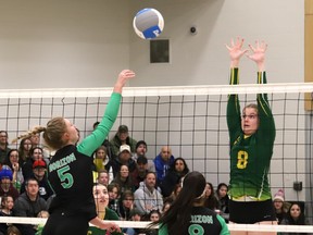 Danika Chenier, right, of Confederation, goes up for a block as Kennedy Bellefeuille, of Horizon, spikes the ball during the division 1 senior girls high school volleyball finals at College Boreal in Sudbury, Ont. on Friday February 17, 2023.