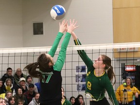 Danika Chenier, right, of Confederation, tries to put the ball past Breanna Lemaire, of Horizon, during the Division 1 Senior Girls High School Volleyball Finals at College Boreal in Sudbury, Ontario.  on Friday February 17, 2023. John Lappa/Sudbury Star/Postmedia Network