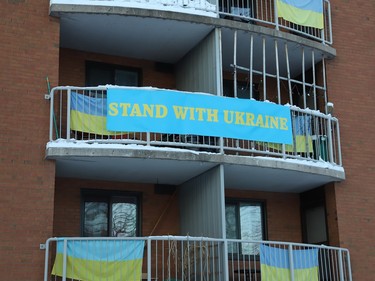 A Stand with Ukraine banner hangs from a balcony at the Ukrainian Centre in Sudbury, Ont. on Friday February 24, 2023. John Lappa/Sudbury Star/Postmedia Network