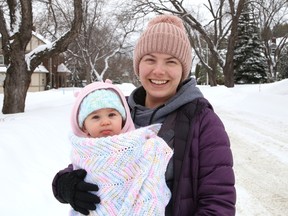 Christine Kamal goes for a walk with her baby, Mazikeen, 9 months, in Copper Cliff, Ont. on Tuesday February 28, 2023.