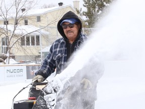 Joe Caridade uses a snowblower to remove snow off the rink at Robinson Playground in Sudbury, Ont. on Tuesday February 28, 2023. John Lappa/Sudbury Star/Postmedia Network