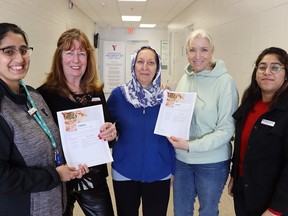 Holding copies of a cookbook of recipes from clients and staff at the YMCA Newcomers Services in Sarnia are, from left, Simranjeet Kour, Marie Watson, Batool Foront, Olha Sloboolianiuk and Muskan Sharma.
Paul Morden/Postmedia