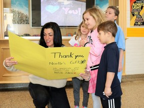 Noelle's Gift's Nicole Paquette (left) received a thank-you card from students from High Park Public School on Feb. 1, after the charity dropped off a $90,000 cheque for the Ontario Student Nutrition Program.
Carl Hnatyshyn/Sarnia This Week