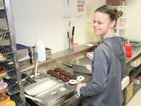 Sarnia Special Olympian Regan Knowles got the chance to make several Special Olympic donuts in the Tim Hortons kitchen. Carl Hnatyshyn/Sarnia This Week