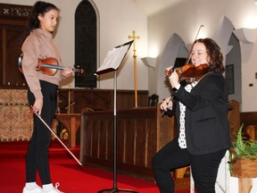 Award-winning concert violinist Mary Elizabeth Brown coaches 13-year-old Eliane Cooper at a master class hosted by the Timmins Symphony Orchestra on Thursday at St. Matthew's Cathedral. Brown travelled from Montreal to teach the master class in advance of Saturday's concert "Celtic Fantasies," where she will be the featured soloist with the TSO. Cooper's performance blossomed with a few concise tips from Brown, who performs with orchestras around the world and is a world-renowned music educator. The Master Class is an example of how non-profits like the TSO enhance quality of life in Timmins.
NICOLE STOFFMAN/The Daily Press