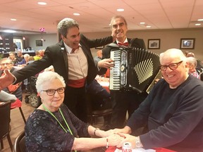 Domenic Colantonio serenades Paul and Aline Gaudreau with "O Sole Mio," as Hector Ciccone accompanies him on accordion. The "Sweetheart Spaghetti Dinner," was held at St. Mary's Gardens for the residents on Valentine's Day. "We have had so much fun and good memories," said Ciccone, of the years they have been performing romantic Italian folk music in Timmins and Italy.

Supplied/Dawna Carrier