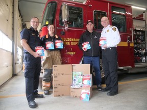 John Gignac, Executive Director of the Hawkins-Gignac Foundation for CO Education, made a donation of 51 carbon monoxide detectors to Tillsonburg Fire and Rescue Services last Tuesday. From left are Tillsonburg's Jadie Scaman, Assistant Chief of Prevention and Training and Sarah Barclay, Public Educator; Gignac, a retired Brantford firefighter; and Shane Caskanette, Tillsonburg Fire Chief. CHRIS ABBOTT