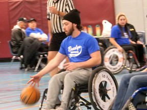 Alex Massengale, Branlyn Neighborhood Association, dribbles up the court during the 25th Wheelchair Basketball Tournament Saturday in Brantford.  CHRIS ABBOTT