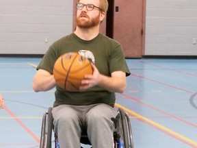 Jesse Dostal, a player on The Aquittables (Lefebvre & Lefebvre LLP), lines up a shot during Saturday's Wheelchair Basketball Tournament in Brantford.  CHRIS ABBOTT