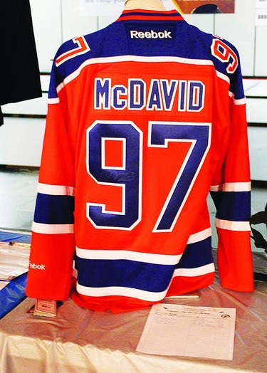 A jersey signed by Edmonton Oiler Connor McDavid was among the silent auction items up for grabs during Bisons Day on Feb. 4, and the winning bid ended up being $900. The McDavid jersey, as well as other silent auction items, were set out in the Vulcan Curliing Club's lounge.