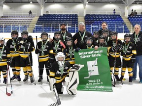 Members of the West Lorne Comets brought home a silver trophy from the Lambton Shores Regional International Silver Stick tournament. With them are coaching staff John Dyer (assistant coach) Kevin Summers (head coach), Collin Knight (assistant coach), Krista Donovan (trainer). MaryjoTait photo