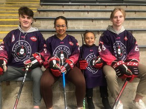 From left to right, Ashley Clock's billet son Riley Lavallee, daughter Adassia Clock, daughter Shantae Clock, and billet son Adam Jiracek, are pictured in 2022 wearing special jerseys the Knights of Meaford. Photo supplied.