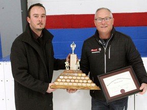 WOAA Vice President Alex Neuman presents Rob Nixon with the O.M. "Mike" Weichel Trophy for his outstanding efforts in minor sports at the Durham Thundercats/72's alumni game celebrating 50 years of the hockey team on Jan. 14, 2023. Photo submitted.