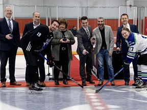 Sault College team captains Caleb Wood and Olivia Barsanti take part in the ceremonial puck drop at the new Northern Community Centre twin pad arena on Mon. Feb. 6, 2023.  ELAINE DELLA-MATTIA.