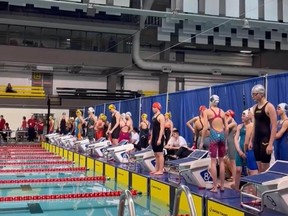 Swimmers get ready to dive into the water at the Kinsmen Sports Centre in Edmonton during the Swim Alberta Provincial Championship.