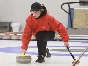 St. Marys DCVI lead Ezra Bender delivers a rock during the WOSSAA boys’ curling bronze-medal game Tuesday in Tillsonburg. The Huron-Perth champion Salukis defeated East Elgin, 7-6.