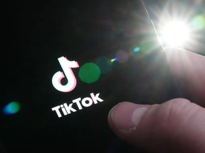 The TikTok startup page is displayed on an iPhone in Ottawa on Monday, Feb. 27, 2023. PHOTO BY SEAN KILPATRICK /The Canadian Press