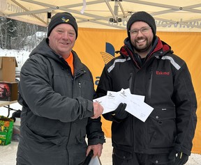 Josh Nokes, right, caught the third, fourth and fifth longest fish during the Laurentian Valley Ice Fishing Derby. Pictured is event volunteer Rick Klatt presenting him with his award.